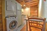 Discover this charming property featuring a well-equipped kitchen with modern appliances, including a washing machine and dryer.
