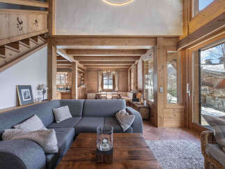 Experience the warmth of this stunning chalet, featuring exposed wooden beams and a cozy ambiance.