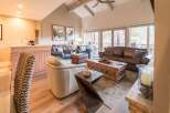 Step into luxury with this stunning living room, featuring a cozy leather sofa and inviting armchairs.