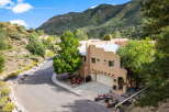 Nestled in a serene mountain setting, this stunning property offers a perfect blend of luxury and natural beauty.