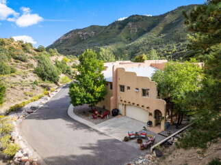 Nestled in a serene mountain setting, this stunning property offers a perfect blend of luxury and natural beauty.