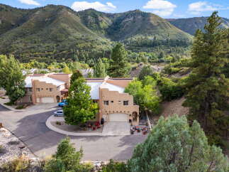 Nestled amidst the stunning backdrop of lush mountains, this property offers a serene and picturesque living experience.