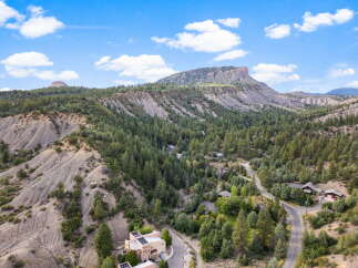 Discover a stunning property nestled in a picturesque mountain landscape.