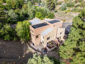 Discover a stunning architectural masterpiece nestled in a serene natural setting.