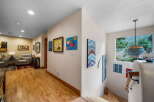 Step into this inviting home and be greeted by a stunning hallway adorned with beautiful artwork.