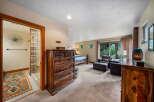 Step into luxury with this stunning bedroom, featuring exquisite wooden furniture and a spacious layout.
