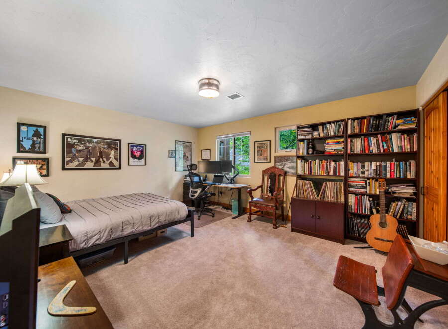 This cozy bedroom offers a comfortable retreat with a stylish design.