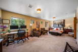 Step into this spacious and inviting bedroom, perfect for relaxation and productivity.