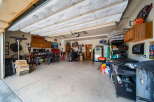 This spacious garage offers ample storage and workspace, perfect for any homeowner.