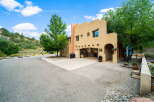 Discover this stunning property featuring a charming stucco exterior and a spacious driveway.