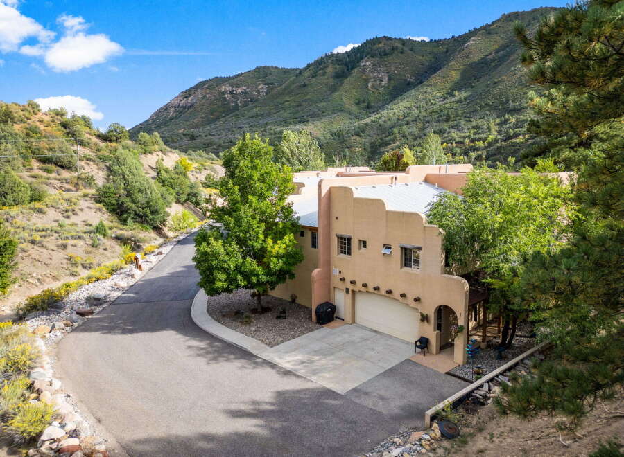 Nestled in a serene mountain setting, this stunning property offers a perfect blend of luxury and natural beauty.