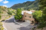 Nestled in a serene mountain setting, this stunning property offers a perfect blend of luxury and natural beauty.