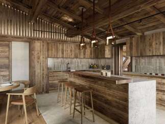 Experience rustic elegance in this stunning kitchen, featuring exquisite wood paneling and a cozy dining area.