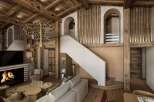 Experience luxury living in this stunning property, featuring a grand staircase and exquisite wooden accents throughout.