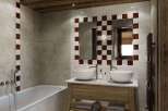 This stunning bathroom boasts a modern design with a rustic touch, perfect for a luxurious living experience.