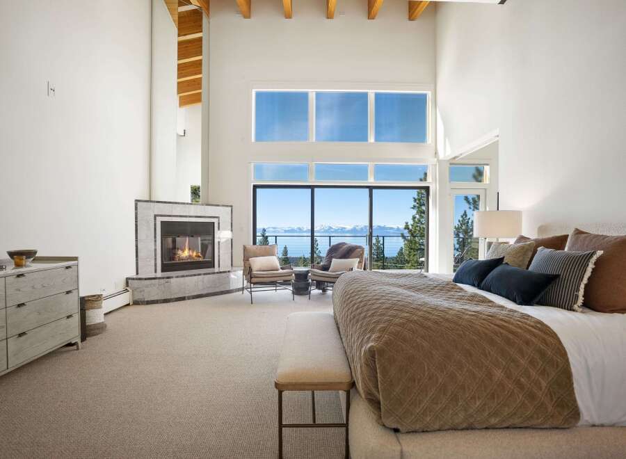 Experience luxury living in this stunning bedroom with breathtaking views.