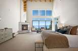 Experience luxury living in this stunning bedroom with breathtaking views.