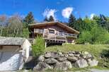 Discover this stunning wooden chalet nestled in a serene, natural setting.