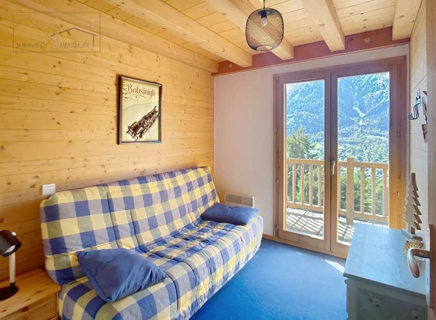 Discover this charming property featuring a cozy living space with a comfortable sofa and a stunning view.
