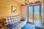 Discover this charming property featuring a cozy living space with a comfortable sofa and a stunning view.