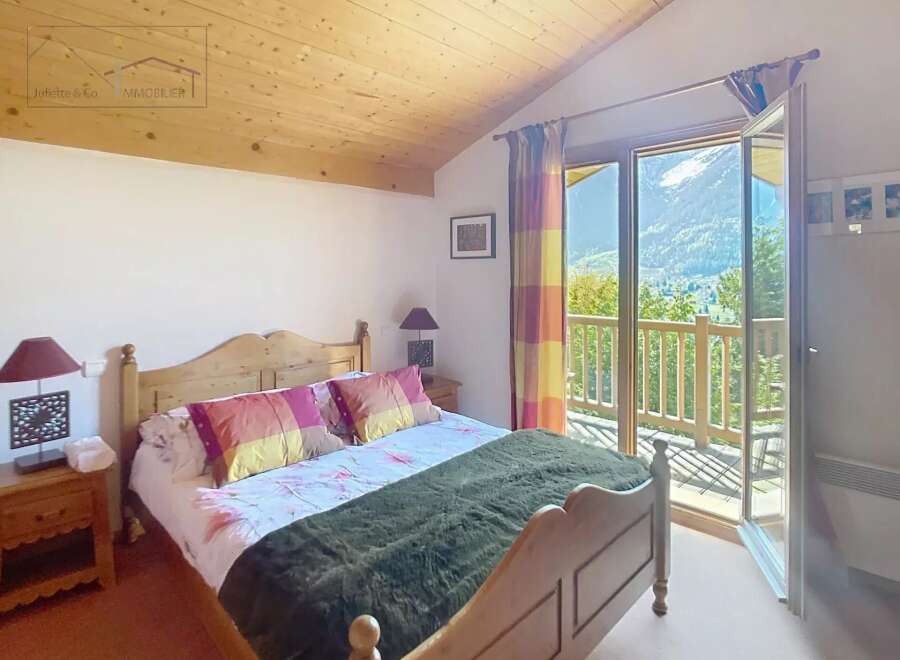 Discover a cozy bedroom with a stunning mountain view.