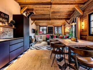 Experience the charm of this stunning property, featuring a rustic wooden ceiling and walls that exude warmth and character.