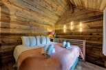 Experience rustic charm in this cozy bedroom.
