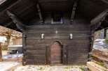 Discover the rustic charm of this unique property, featuring a beautifully crafted wooden facade.