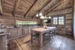 This stunning kitchen boasts a rustic, yet modern design, perfect for those seeking a unique property.