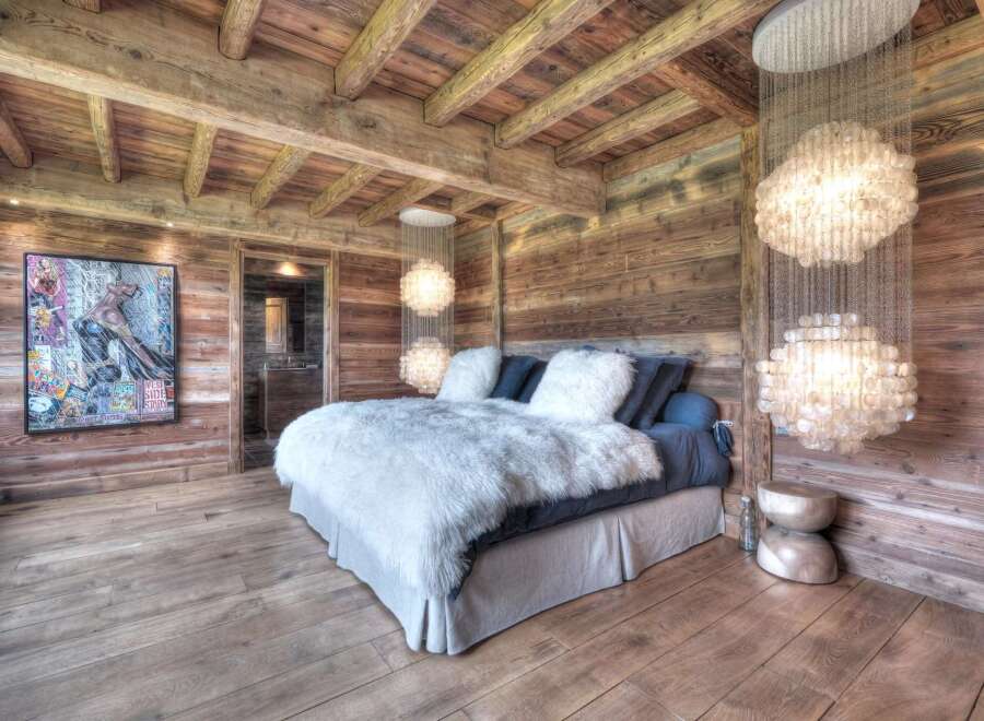 Experience rustic luxury in this stunning bedroom.