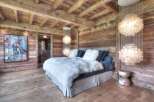 Experience rustic luxury in this stunning bedroom.