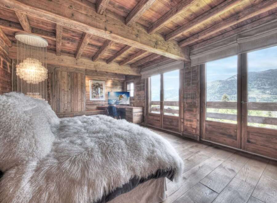 Experience the epitome of luxury in this stunning chalet bedroom.