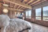 Experience the epitome of luxury in this stunning chalet bedroom.