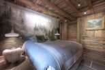 Experience rustic elegance in this stunning bedroom.