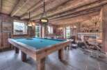 Step into luxury with this stunning property featuring a rustic game room.