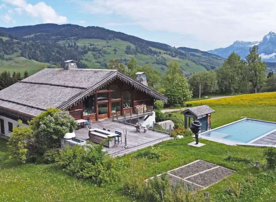 Escape to your dream home nestled in the heart of nature! This stunning property boasts a luxurious wooden chalet with a spacious deck, perfect for entertaining.