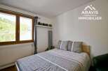 Discover a cozy bedroom retreat with a comfortable bed and stylish bedding.