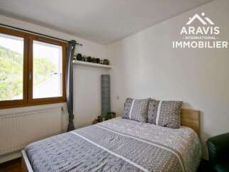Discover a cozy bedroom retreat with a comfortable bed and stylish bedding.