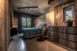Experience rustic elegance in this stunning bedroom.
