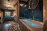 Experience luxury in this stunning bedroom featuring a spa-like bathroom.