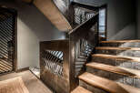 This stunning property boasts a unique staircase design, showcasing modern architectural elements.