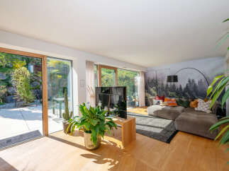 Experience luxury living in this stunning property featuring expansive windows that flood the space with natural light.
