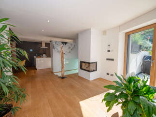 This stunning property boasts a modern open-plan living space with beautiful hardwood floors.