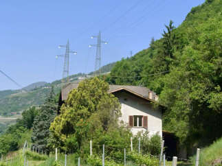 Nestled amidst the serene beauty of the mountains, this charming property offers a tranquil escape.
