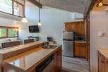 This stunning kitchen boasts a sleek design with modern appliances and ample counter space, perfect for culinary enthusiasts.