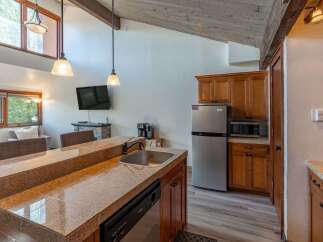 This stunning kitchen boasts a sleek design with modern appliances and ample counter space, perfect for culinary enthusiasts.