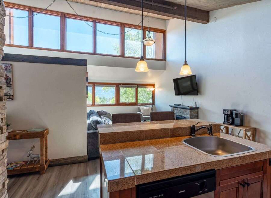 This stunning property boasts a modern kitchen with granite countertops and stainless steel appliances, perfect for culinary enthusiasts.