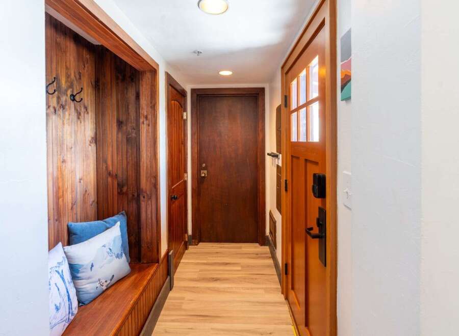Step into this inviting entryway, featuring a cozy built-in bench perfect for putting on shoes.