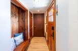 Step into this inviting entryway, featuring a cozy built-in bench perfect for putting on shoes.