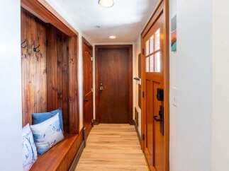 Step into this inviting entryway, featuring a cozy built-in bench perfect for putting on shoes.